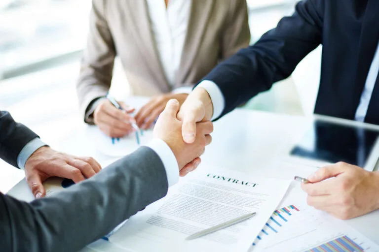 Business leaders shaking hands
